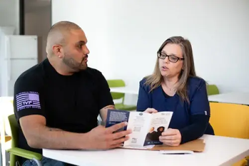 Veterans discussing brochure